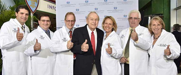 Dr. Alejandro Levy, Dr. Robert Sutphin, Dr. Don Eslin, Dr. Amy Smith, Dr. Vincent Giusti and Dr. Susan Kelly celebrate the exciting news with Arnold Palmer at Arnold Palmer Hospital.