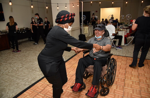 woman dancing with man in wheelchair
